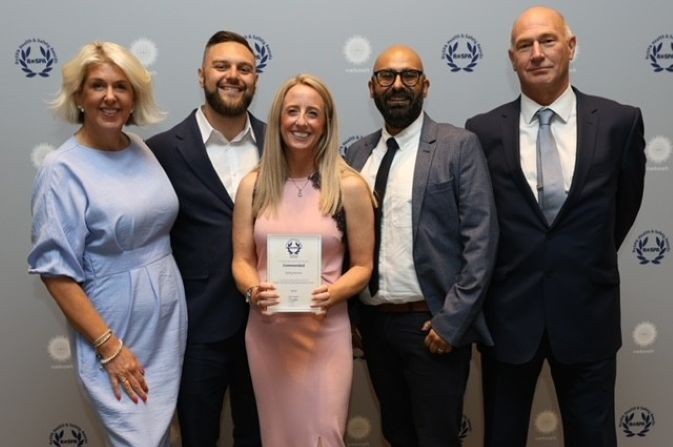 Derby Homes health and safety team collecting their award.